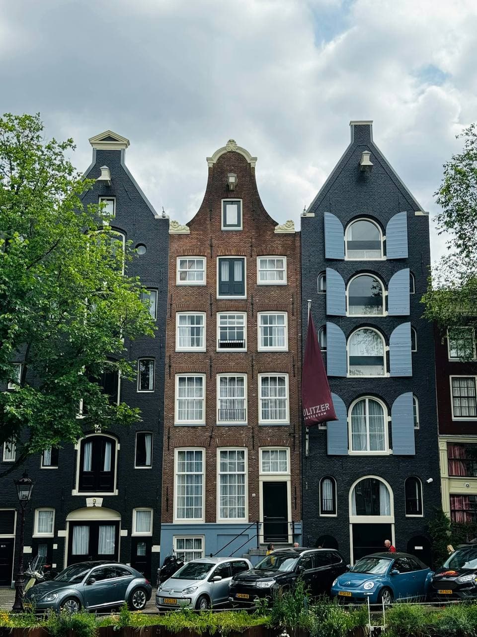 Three gabled canal houses side by side